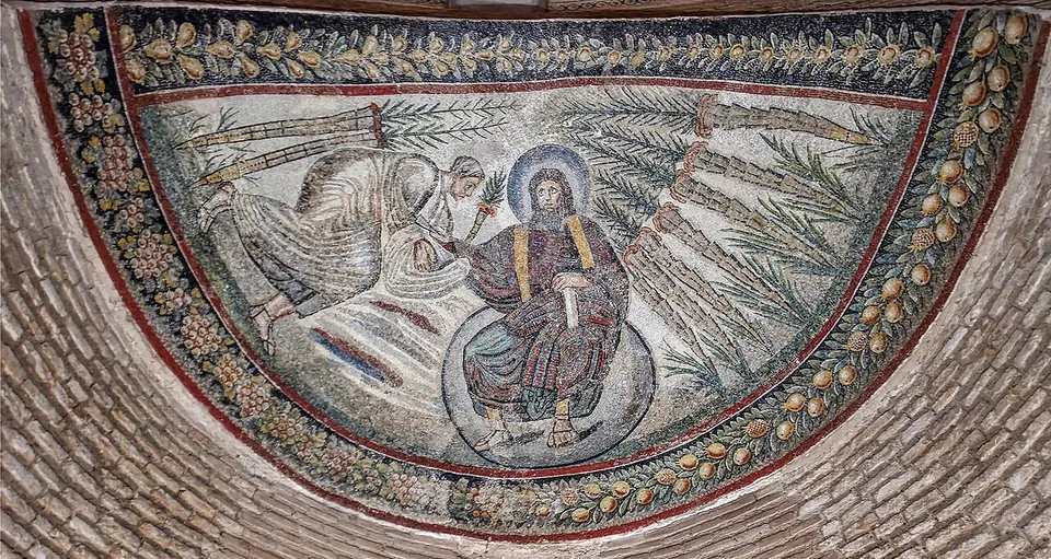 A half-dome mosaic of a bearded, haloed figure in a dark robe seated on a globe, handing a scroll to a bowing figure who receives it with covered hands, against a pale ground with palm fronds, inside a border of fruit.