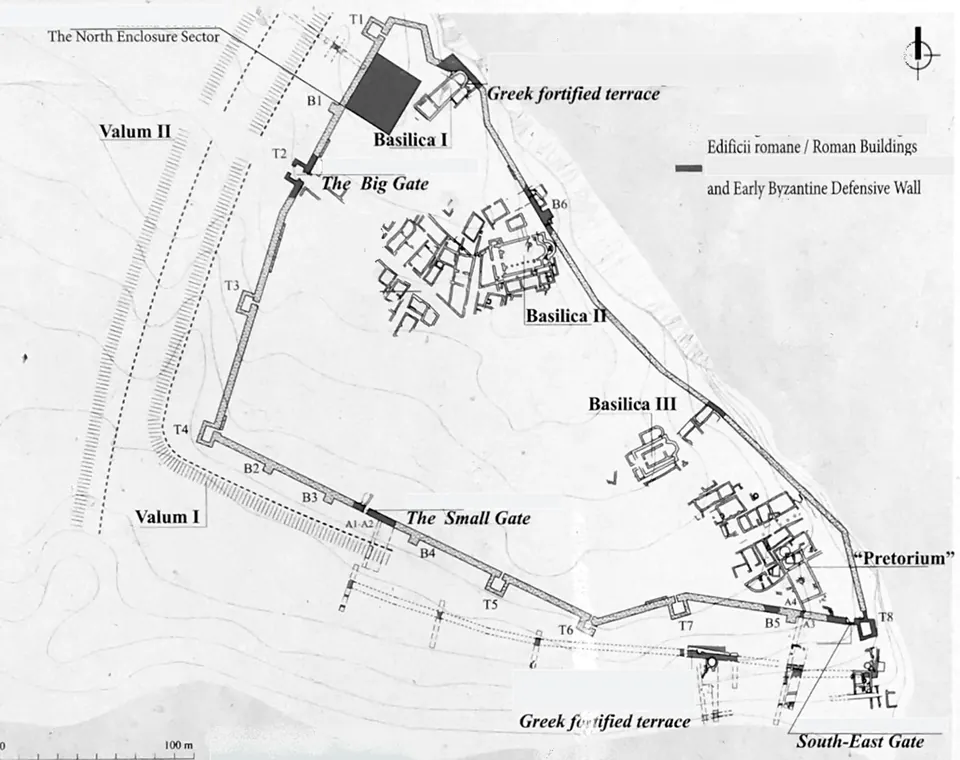 A black-and-white site plan of a walled headland, marking the big and small gates, the towers, three basilicas, a building labelled praetorium, the Greek fortified terrace and two earthwork lines, with a key to the Roman buildings and early Byzantine wall.