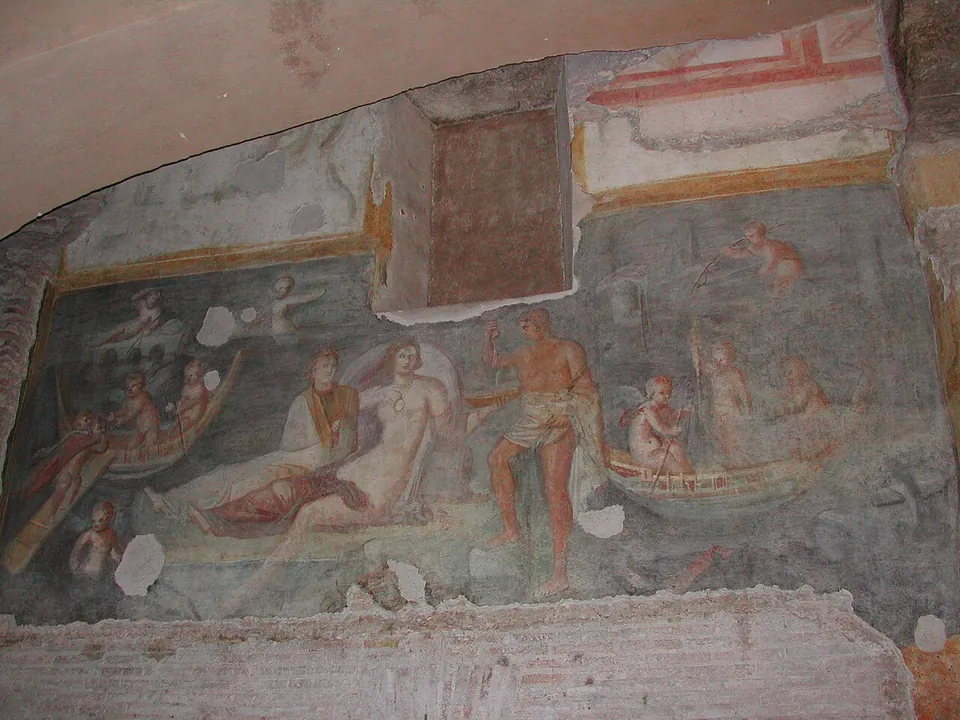 A large wall painting on a blue-green ground with figures gathered at the centre, one of them a half-naked woman reclining, and small naked boys in boats around them; patches of plaster are missing and a rectangular niche is cut into the top of the wall.