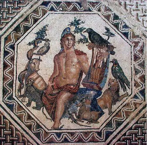 A colourful mosaic panel in an octagonal frame showing a bare-chested young man in a pointed cap playing a lyre, surrounded by birds and animals.