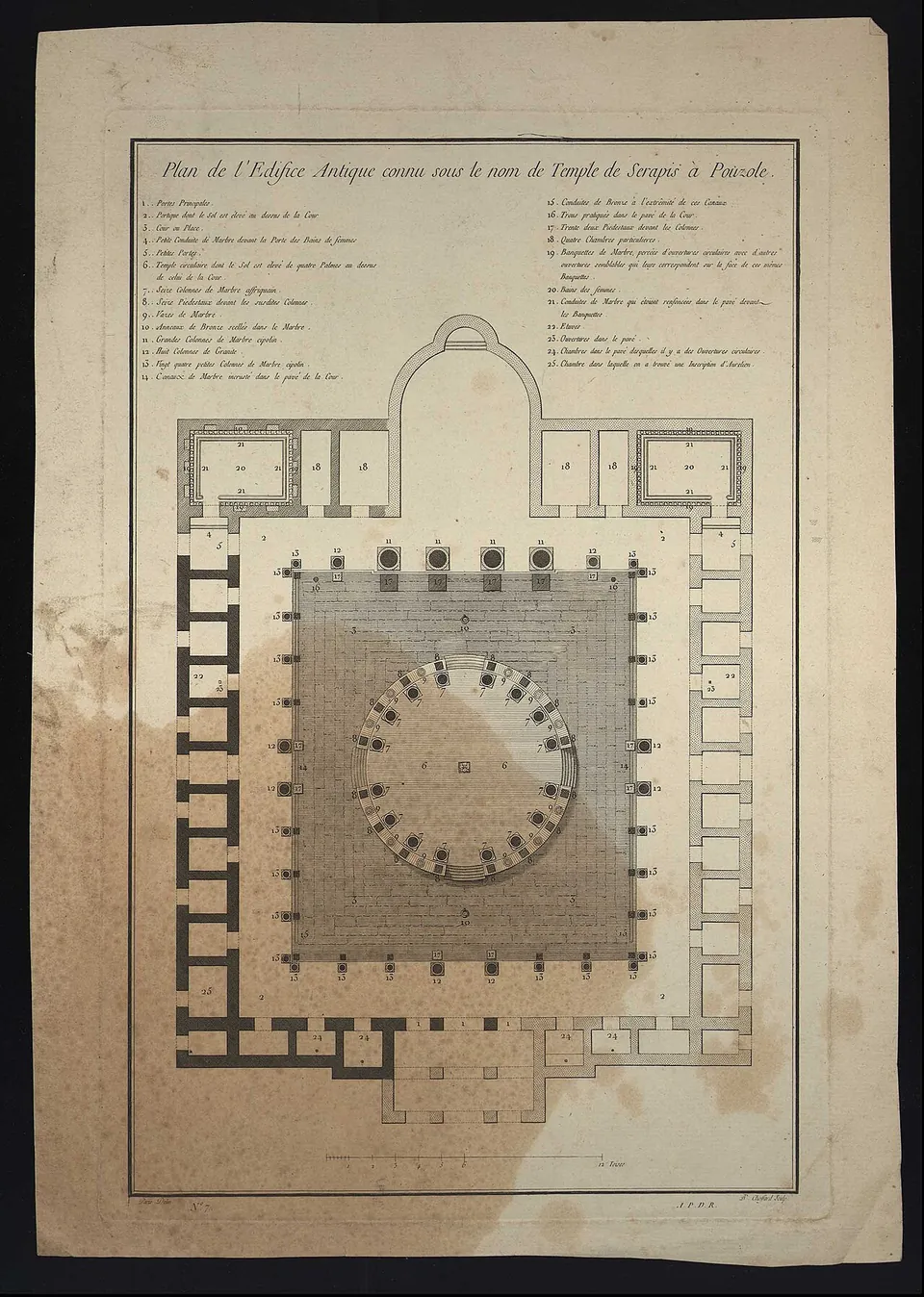 An old printed ground plan on stained paper, showing a square courtyard with a circle of columns at its centre, rows of small rooms along its sides and an apsed hall at the top, with a written key above it.