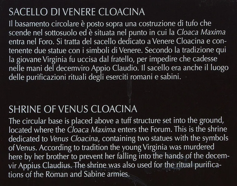 A dark information panel with white text in Italian and English headed "Shrine of Venus Cloacina".