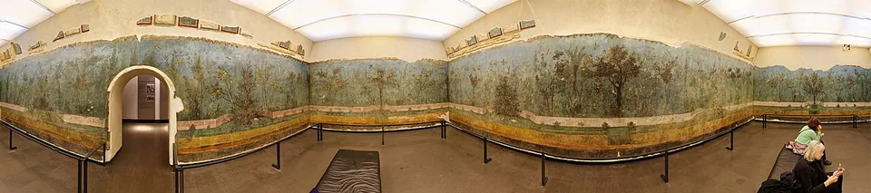 A 360-degree panorama of a closed room whose walls are painted all round as a dense garden of trees and shrubs against a blue-green sky above a painted band at the foot of the walls, with an arched doorway in one wall and visitors seated behind a railing.